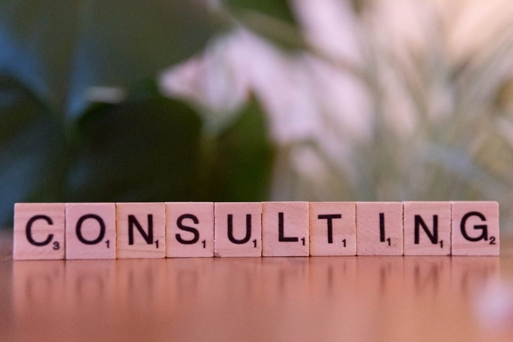 a-wooden-block-spelling-consulting-on-a-table-ocetxj93mww